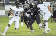  ?? / Jeremy Stewart ?? Rockmart’s Markus Smith juked out of the way of a Coosa defensive tackle during the Jackets’ latest win last Friday night.