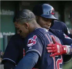  ?? JIM YOUNG — THE ASSOCIATED PRESS ?? Rajai Davis, rear, is congratula­ted by teammate Francisco Lindor after scoring a run during the third inning May 23in Chicago.