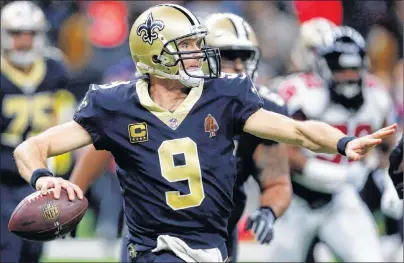  ?? AP PHOTO ?? This Dec. 24, 2017, file photo shows New Orleans Saints quarterbac­k Drew Brees passing in the second half of an NFL game against the Atlanta Falcons in New Orleans.