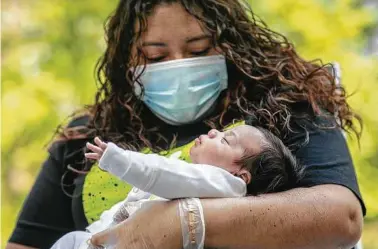  ?? John Moore / Getty Images ?? The birth rate in Texas is falling faster pace than the national average, and that could threaten the state’s booming economy.