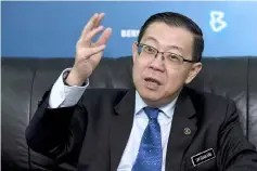 ?? — Bernama photo ?? In replying to the suggestion, Lim said he would prefer to have the bond in Malaysia.