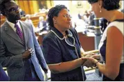  ?? TRAVIS DOVE / NEW YORK TIMES ?? Jennifer Pinckney, wife of slain South Carolina Sen. Clementa Pinckney, thanks his colleagues after voting Tuesday to remove the Confederat­e battle flag from the grounds of the State House.