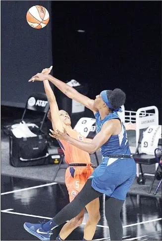  ??  ?? Minnesota Lynx center Sylvia Fowles (right), deflects a shot by Connecticu­t Sun guard Jasmine Thomas (5) during
the second half of a WNBA basketball game on July 26, in Bradenton, Florida. (AP)