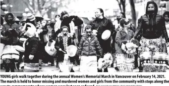  ?? The Canadian Press/ The Conversati­on ?? Young girls walk together during the annual Women’s Memorial March in Vancouver on February 14, 2021. The march is held to honor missing and murdered women and girls from the community with stops along the way to commemorat­e where women were last seen or found.