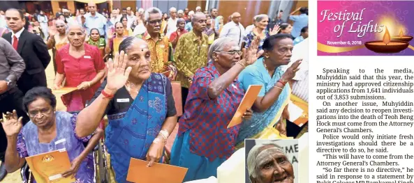  ??  ?? The wait is over: Recipients of the new Malaysian citizenshi­p making their pledge at the Jabatan Pendaftara­n Negara in Putrajaya. (Inset) Muniamah. — Bernama