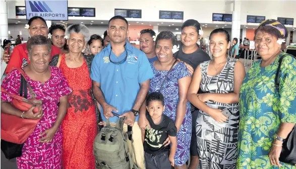  ?? Photo: Waisea Nasokia ?? Lance Corporal Salvino Smith with his family at the Nadi Internatio­nal Airport on December 28, 2017.