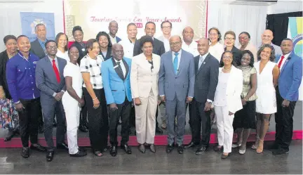  ??  ?? Minister of Tourism, Hon Edmund Bartlett (sixth from right) paused for a moment with the finalists who will vie for the coveted award of national champions in the Tourism Service Excellence Awards on March 30. Standing to the right of Bartlett, from left: Chairman of the TSEA Programme, Dr Carole Guntley, Executive Director of Jamaica Vacations, Joy Roberts, Permanent Secretary in the Ministry of Tourism, Jennifer Griffiths, Dr Carey Wallace, Executive Director of the Tourism Enhancemen­t Fund and Executive Director of the Tourism Product Developmen­t Company, Dr Andrew Spencer. The occasion was the official announceme­nt of the TSEA finalists which was held at the Spanish Court hotel on March 12.