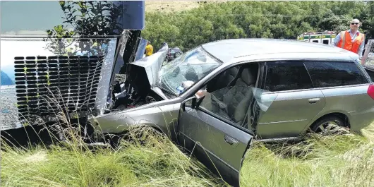  ?? PHOTO: KERRIE WATERWORTH ?? Close call . . . A family escaped serious injury after this car and bus collided on the Lindis Pass yesterday.