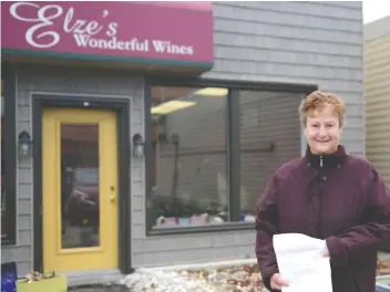  ?? [ALI WILSON / THE OBSERVER] ?? Elze Bredenkamp, owner of Elze’s Wonderful Wines, is protesting alongside local businesses against the requested Elmira BIA levy that would see her annual contributi­on double.