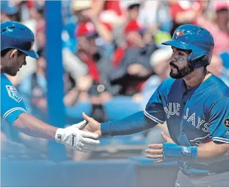  ?? CHRIS O'MEARA THE ASSOCIATED PRESS ?? Blue Jays' Devon Travis, right, has been a full participan­t in this spring training for the first time in years.