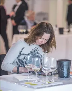  ??  ?? Right: Jane Anson tasting some of the150 Graves and Pessac-Léognan wines she rated forDecante­r’s en primeur report