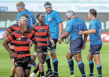  ?? Picture: GORDON ARONS/GALLO IMAGES ?? HEAVY DEFEAT: EP Elephants captain Inny Radebe, centre, walks back to his tryline after Nizaam Carr's try for the Bulls in the Preparatio­n Series on Sunday at Loftus, in Pretoria