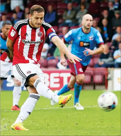  ??  ?? RAZOR SHARP: Sheffield’s United’s Billy Sharp scored a late penalty to equalise