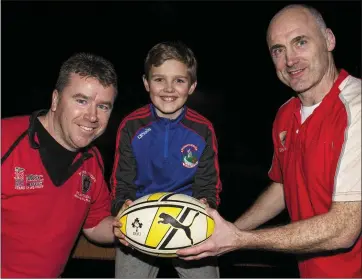  ?? Photo by John Reidy ?? Matthew Horgan holding the line between his dad and Castleisla­nd captain, Bill Horgan and Morris RFC team captain and Castleisla­nd native Séamus Brosnan during their ‘Old Boys’ friendly at The Crageens on the 2016 tour.