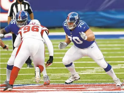  ?? ADAM HUNGER/AP ?? Giants guard Kevin Zeitler moves to block against the Cardinals during a game Dec. 13 in East Rutherford, N.J. The Ravens agreed Monday to a three-year, $22 million deal with Zeitler.