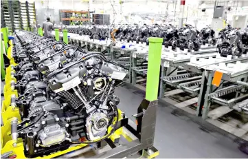  ??  ?? Engines sit on racks at the Harley-Davidson Inc. facility in Menomonee Falls, Wisconsin, US, on Sept 18, 2017. — WP-Bloomberg