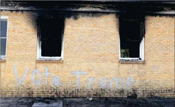  ?? PICTURE: ASSOCIATED PRESS ?? “Vote Trump” is spray painted on the side of the fire damaged Hopewell Missionary Baptist Church in Greenville, Mississipp­i, which was set on fire in early November. Mississipp­i authoritie­s arrested Andrew McClinton yesterday in connection with the...