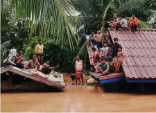  ??  ?? Villagers evacuate after the Xepian-Xe Nam Noy hydropower dam collapsed in Attapeu province, Laos. Photo: Reuters