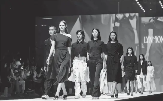  ?? GETTY IMAGES ?? Runway models present clothes during the Spring/Summer 2023 Shanghai Fashion Week in September.