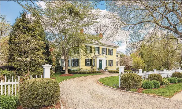  ?? Contribute­d photos ?? Made for entertaini­ng, this Southport home features a bright and airy chef’s kitchen with center island and white cabinetry, a butler’s pantry, formal living with marble fireplace, and dining area with French doors leading to the terrace.