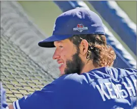  ?? Associated Press ?? Los Angeles Dodgers pitcher Clayton Kershaw looks on during practice on Tuesday in Los Angeles for the upcoming NLDS against the New York Mets.
