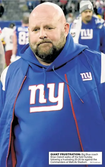  ?? Bill Kostroun ?? GIANT FRUSTRATIO­N: Big Blue coach Brian Daboll walks off the field Sunday following a frustratin­g 20-20 tie against the Commanders at MetLife Stadium.