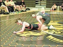  ?? Barbara hall ?? The Calhoun and Sonoravill­e wrestling teams, shown here squaring off in the smaller weight class last Friday at the New Year’s Duals, will begin their playoffs this weekend with the Region Duals tournament­s.