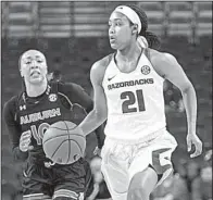 ?? Special to the NWA Democrat-Gazette/DAVID J. BEACH ?? Arkansas Razorbacks guard Devin Cosper (right) dribbles past Auburn defender Brandy Montgomery during Sunday’s game at Walton Arena in Fayettevil­le. Cosper scored 14 points, but the Tigers erased a 7-point fourth-quarter deficit to knock off the...