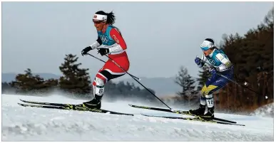  ?? CLIVE MASON / GETTY IMAGES ?? Cross-country skier Marit Bjoergen of Norway (left), competing in her fifth Olympics, added a silver medal to her collection Saturday and is the most decorated female Winter Olympian ever with 11 medals.