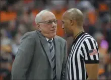  ?? NICK LISI ?? Syracuse head coach Jim Boeheim, left, talks to an official about a call during the second half of an NCAA college basketball game against Louisville in Syracuse, N.Y., Wednesday, Feb. 20, 2019. Syracuse won 69-49.