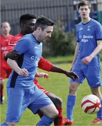  ??  ?? Ibrahim Savage, Carbury, in action with Keith Lynch, St Johns.