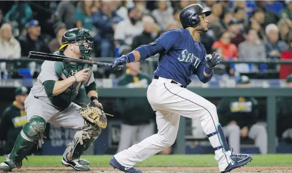  ?? TED S. WARREN/ THE ASSOCIATED PRESS ?? Second baseman Robinson Cano continues to be the key piece of the puzzle for the Seattle Mariners as they head for spring training in Arizona. Cano hit .298 with 39 homers and 103 RBI last season. The biggest off-season splash was acquiring Jean...
