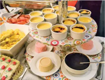  ??  ?? Some of the fruits and desserts at the dinner buffet. I love their panna cotta (bottom layer)