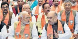  ?? PTI ?? PM Narendra Modi and Amit Shah at the BJP Parliament­ary meeting in New Delhi on Friday.