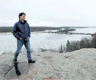  ?? LARS HAGBERG/THE CANADIAN PRESS ?? Prime Minister Justin Trudeau looks out over the Thousand Island National park in Gananoque, Ont., on Tuesday.