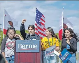  ?? Allen J. Schaben Los Angeles Times ?? A GROUP of young supporters rallies at a Bernie Sanders event Friday at Valley High School in Santa Ana. Sanders won two-thirds of younger voters in Nevada.
