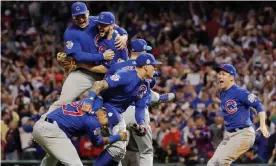  ?? Photograph: Matt Slocum/AP ?? The Chicago Cubs celebrate after defeating the Indians 8-7 in Game 7 to win the World Series in Cleveland.