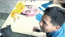  ?? PICTURE: AP ?? A man paints a satirical portrait of Guatemala’s President Jimmy Morales to show support for calls for the removal of Morales’ political immunity in a probe into illicit electoral financing.