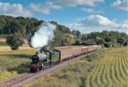  ?? DON BISHOP ?? ‘Manor’ No. 7828 Odney Manor approaches Crowcombe Heathfield with a Bishops Lydeard to Blue Anchor service on October 3. As reported last month, the WR 4-6-0 is temporaril­y running with a 4000 gallon tender on loan and previously used with No. 7802 Bradley Manor while a new one is constructe­d for it at Minehead.