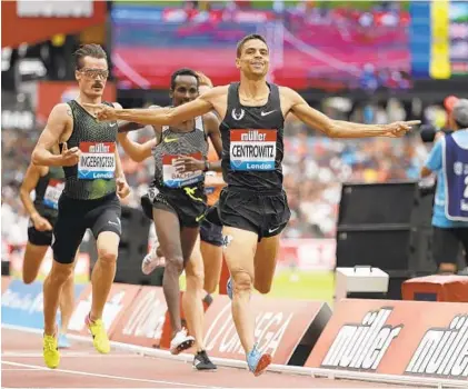  ?? MATT DUNHAM/ASSOCIATED PRESS ?? Broadneck High graduate Matthew Centrowitz Jr. crosses the finish line to win the men’s 1,500 meters race at the IAAF Diamond League meet in London on July 22. Centrowitz has made a steady return to form since dealing with injuries after winning Olympic gold.