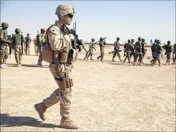  ?? Marcus Yam Los Angeles Times ?? MARINE SGT. Matt Deitrich helps train Afghan soldiers in Helmand province last year. Pakistan is not to blame for the “quagmire called Afghanista­n,” says Aizaz Ahmad Chaudhry, Pakistan’s ambassador to the U.S.