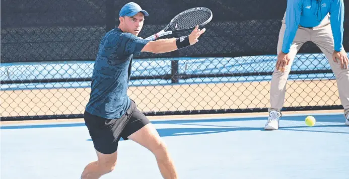  ?? Picture: Bev Lacey ?? CHAMPION EFFORT: Dayne Kelly plays a stroke during his Toowoomba Internatio­nal men’s final victory over Jacob Grills.