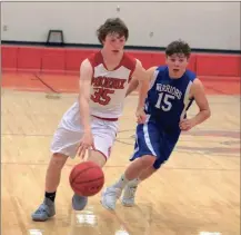  ?? LARRY GREESON / For the Calhoun Times ?? Red Bud’s Brant Bryant (35) dribbles past Ashworth’s Brison McGinness during last Monday’s game.