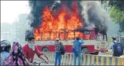  ?? HT PHOTO ?? A roadways bus was set afire near the Allahabad University by the supporters of the slain BSP leader.