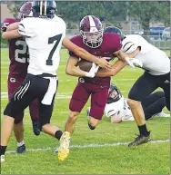  ?? Westside Eagle Observer/RANDY MOLL ?? Gentry’s Dillon Jarnagan attempts to run the ball past West Fork defenders.