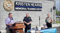  ?? Olivia Morley ?? Floyd County Commission­er Scotty Hancock (left) reads the proclamati­on dedicating the Floyd County Sheriff’s Office Training Center to Kristen Hearne. Picture also includes Polk County Police Chief Kenny Dodd and Chaplain David Thornton.