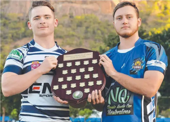  ?? COVETED PRIZE: Brothers player Daniel Muguira and Josh Foreman of Western Lions with the under- 20s TDRL grand final shield. Picture: FIONA HARDING ??