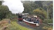  ?? PHILIP MACEY ?? Though not open to passengers, the new Burrs station was a popular vantage point for viewing Flying Scotsman during its visit to the ELR. The Gresley ‘A3’ performs for the crowd on October 16.