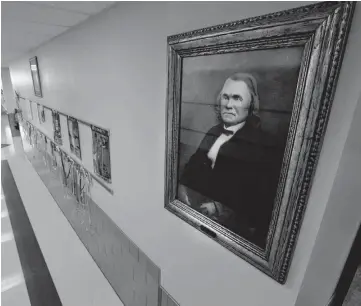  ??  ?? A portrait of Stand Watie hangs in the hall of Stand Watie Elementary in Oklahoma City. Watie, a Confederat­e general, was a member of the Cherokee Nation.