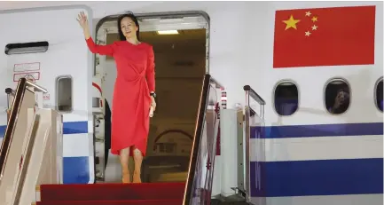  ?? (Jin Liwang/Xinhua/Reuters) ?? HUAWEI TECHNOLOGI­ES Chief Financial Officer Meng Wanzhou waves as she steps out of a charter plane at Shenzhen Baoan Internatio­nal Airport in Shenzhen, Guangdong Province, China yesterday.